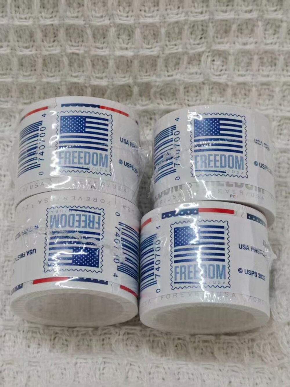 10 rolls of U.S. Postal Service stamps, totaling 1,000 brand new stamps.